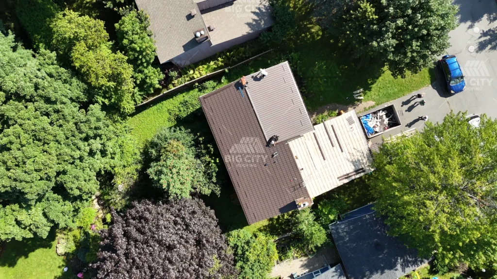 Metal roof installation in Kanata with new plywood on part of the roof